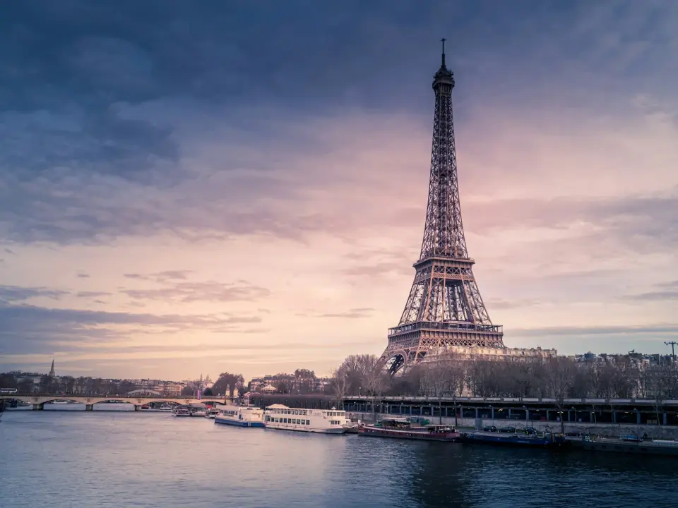 The Eiffel Tower above the River Seine at dusk in Paris